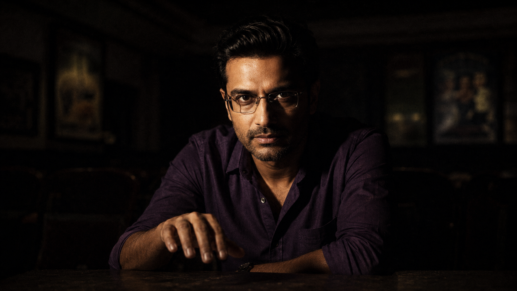 Cinematic noir portrait of Surya in a dark study, lit by a flickering light